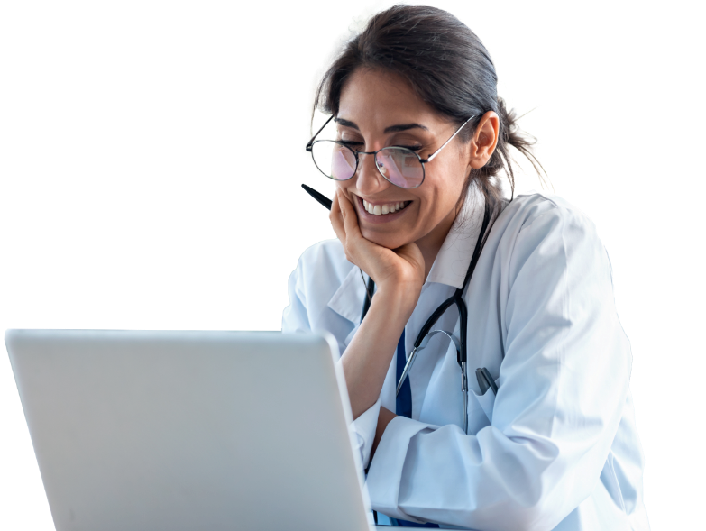 Doctor smiling while looking at a laptop computer